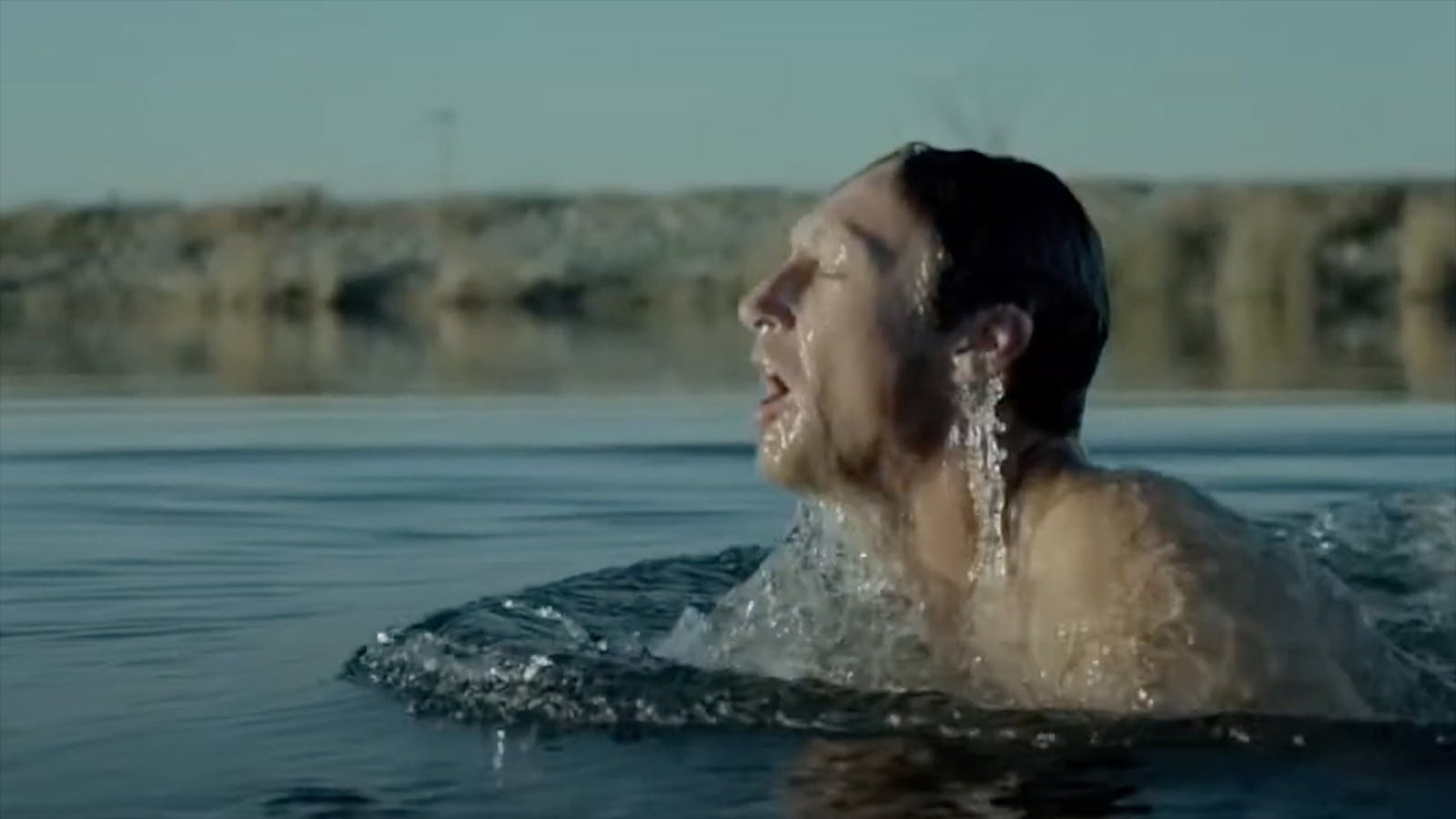 Close-up of man swimming in nature as part of the “Hold Your Breath” campaign.